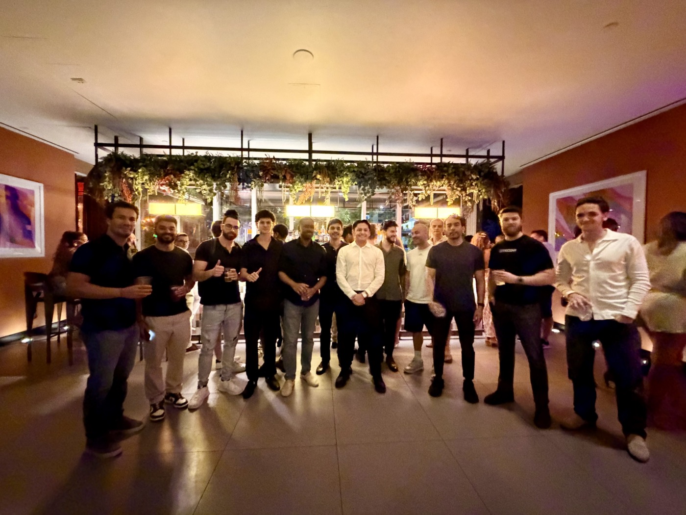 Attendees gathered for a group photo at Brandon Candela's Miami tech networking event